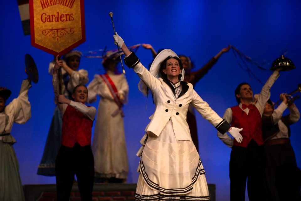 Dolly Dolly and the cast perform a main song and dance number